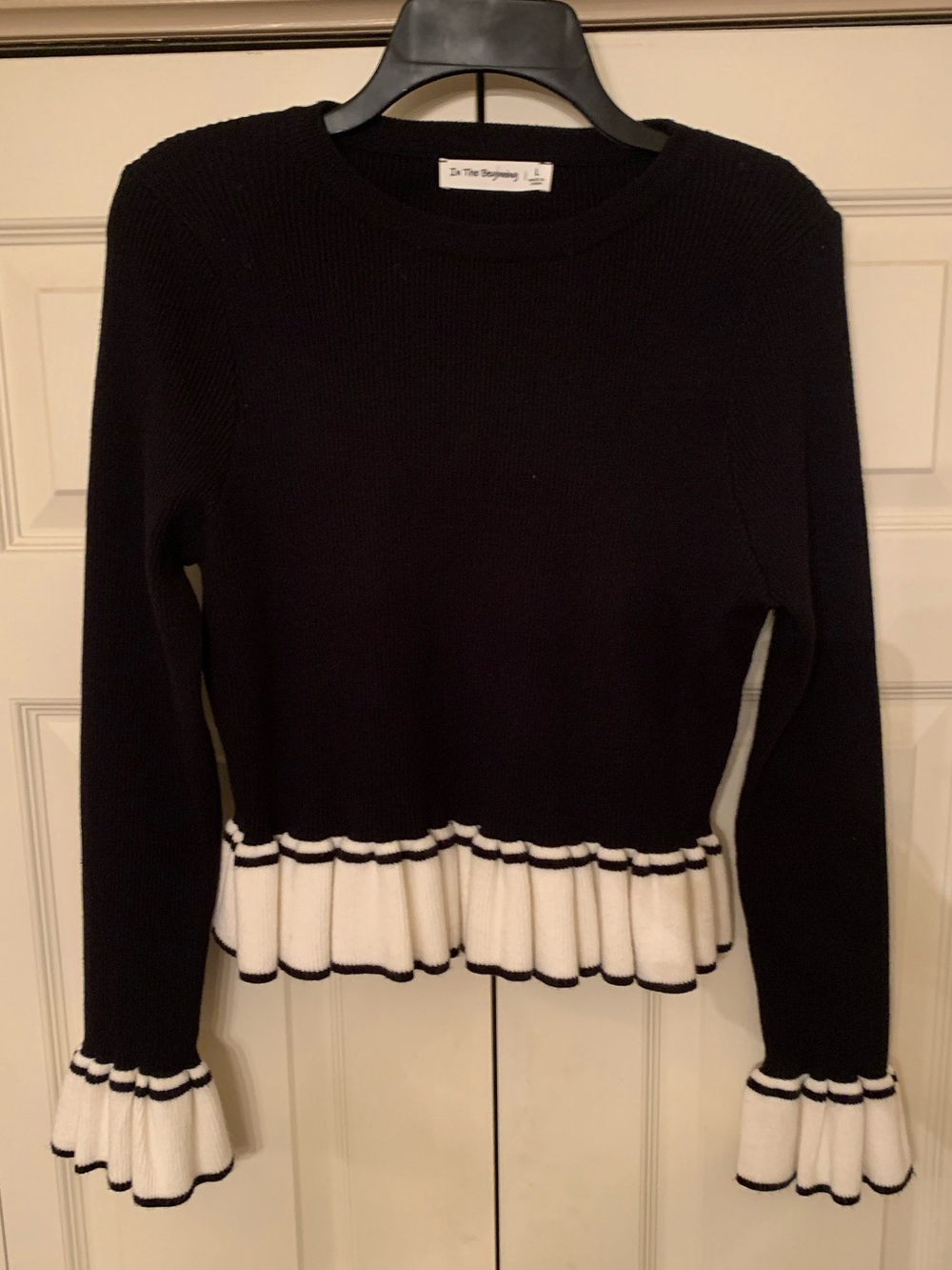 In The Beginning Black Ruffle Hem & Cuff Sweater with White Trim